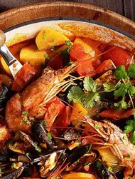 Ovnbagt cataplana med muslinger og rejer